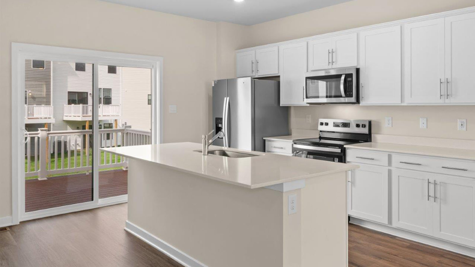 white shaker cabinets and quartz counters