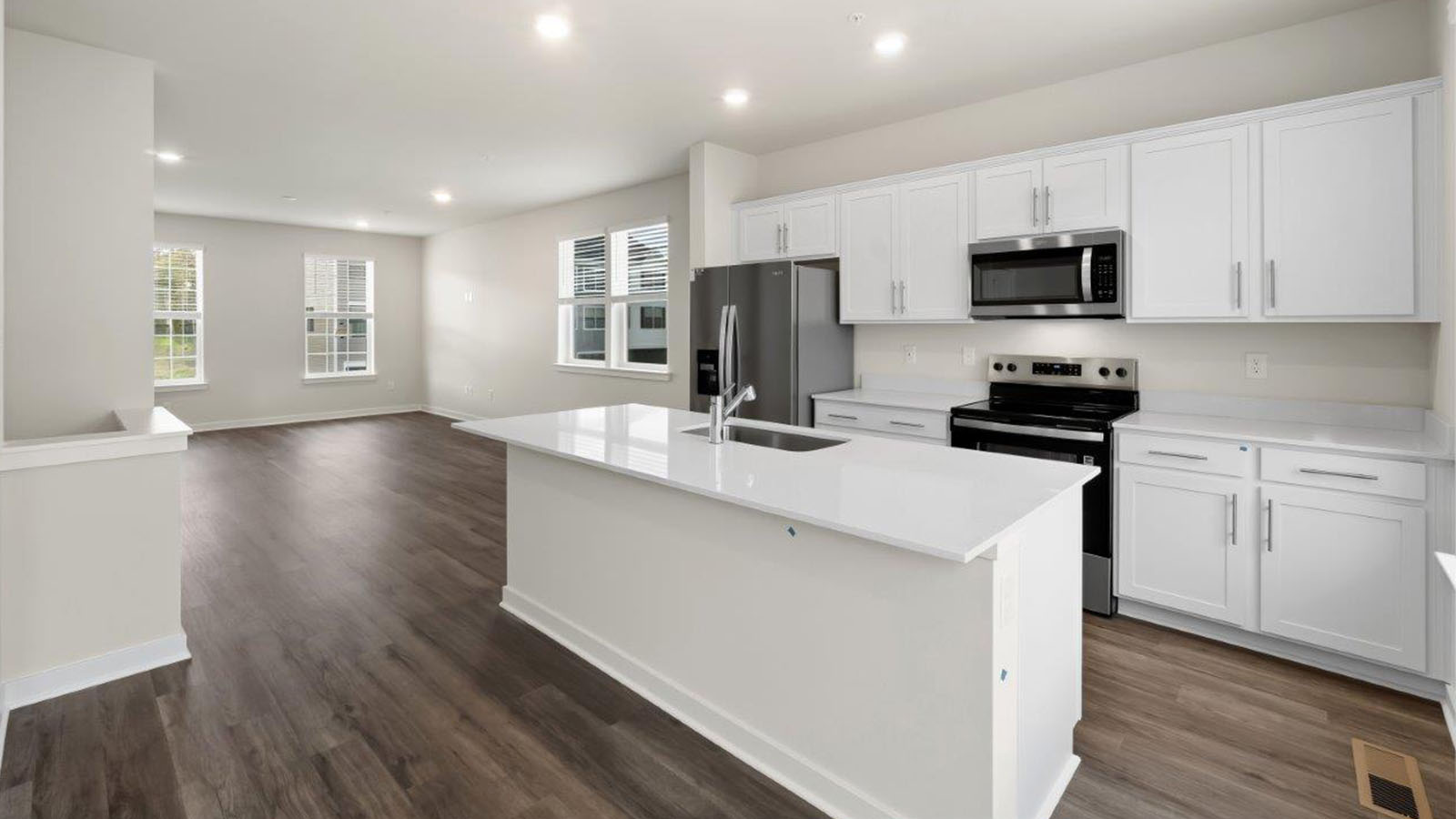 kitchen with white shaker kitchen cabinets