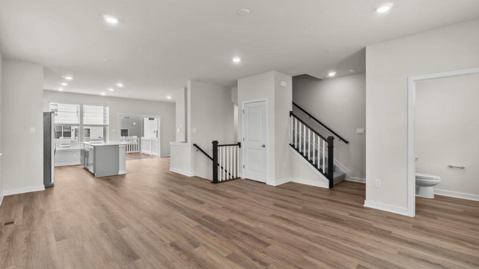 living area with hardwood flooring
