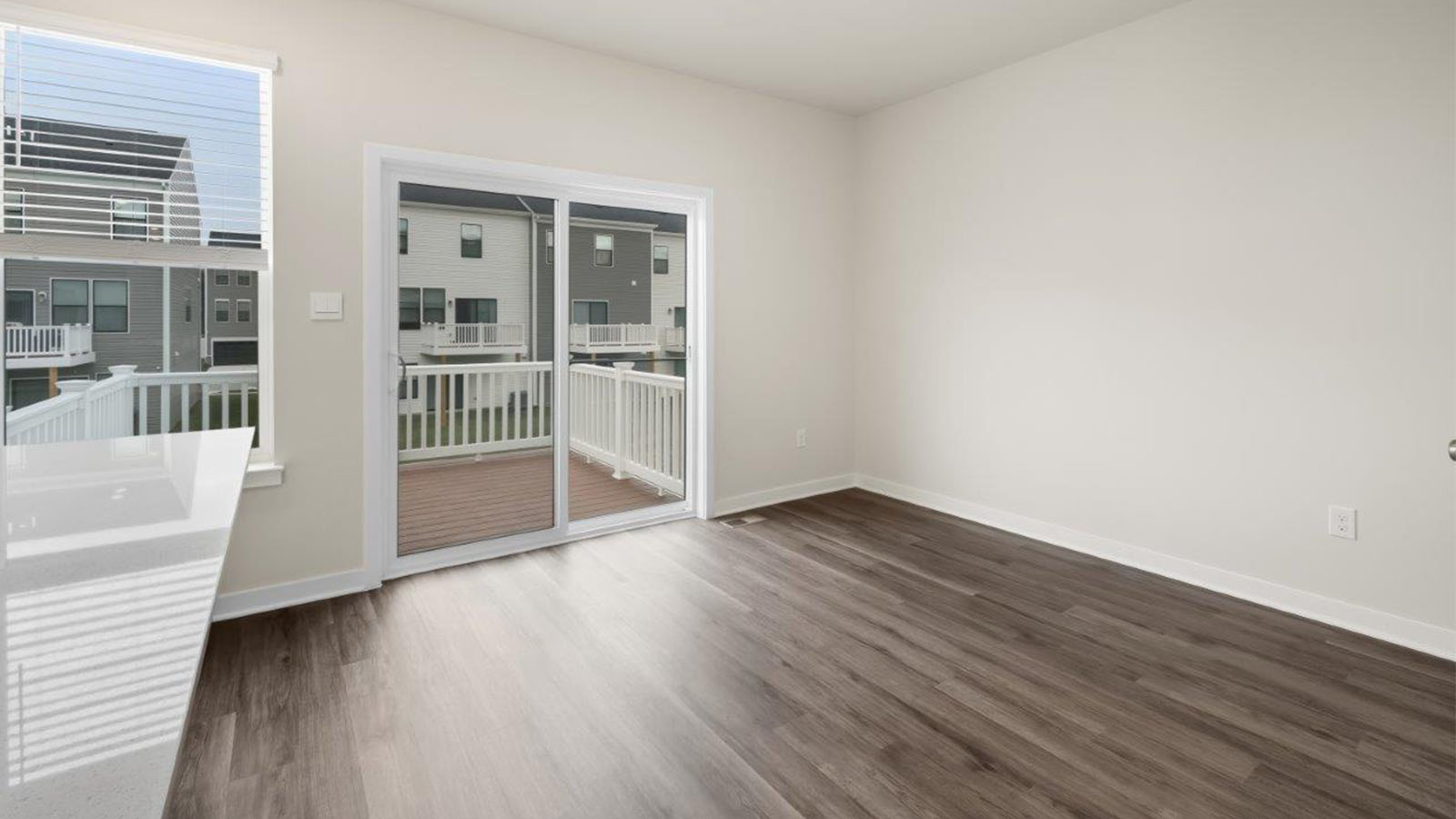 dining area leading to sliding back door