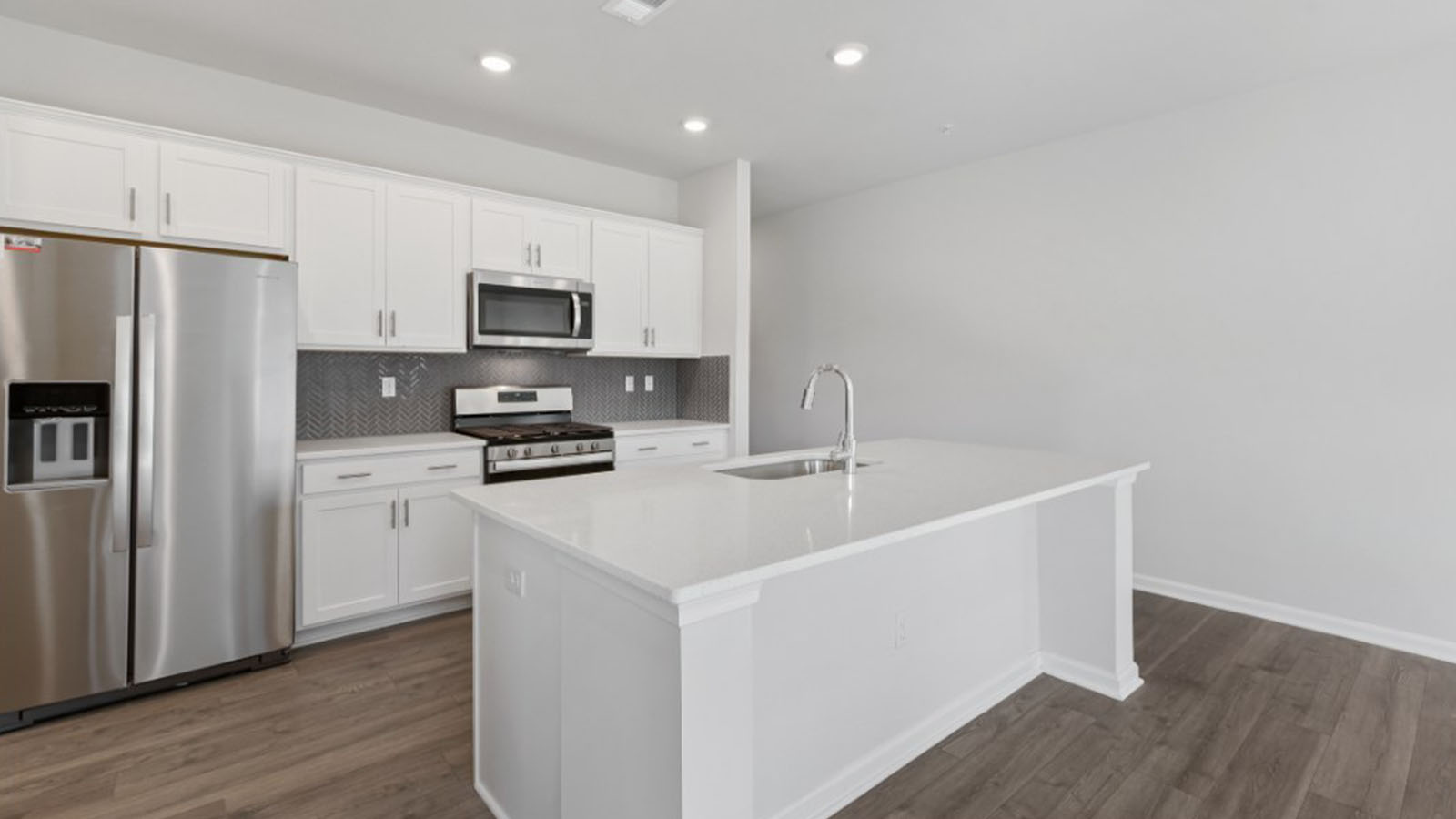 island with seating and recessed lighting