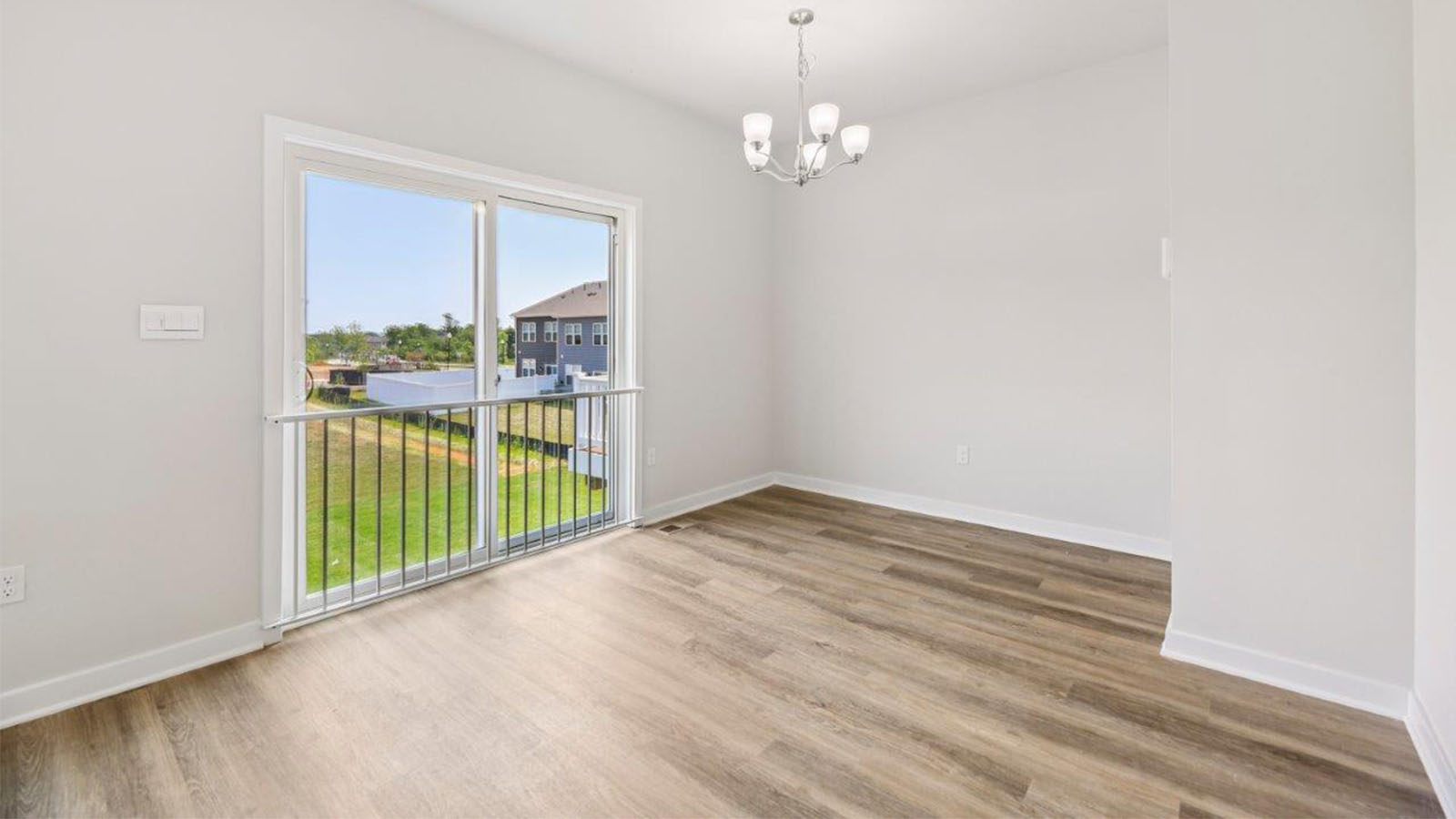 open concept living room leading to sliding back door