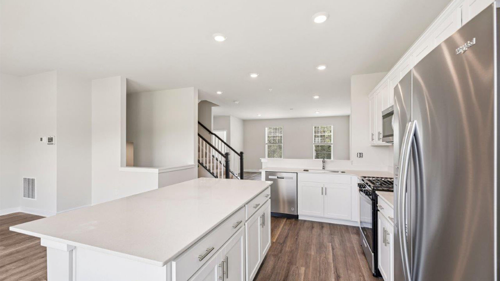 stainless steel appliances and quartz island