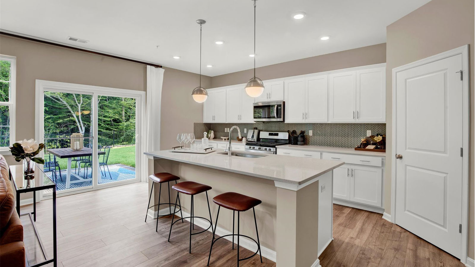spacious kitchen wiht white shaker cabinets