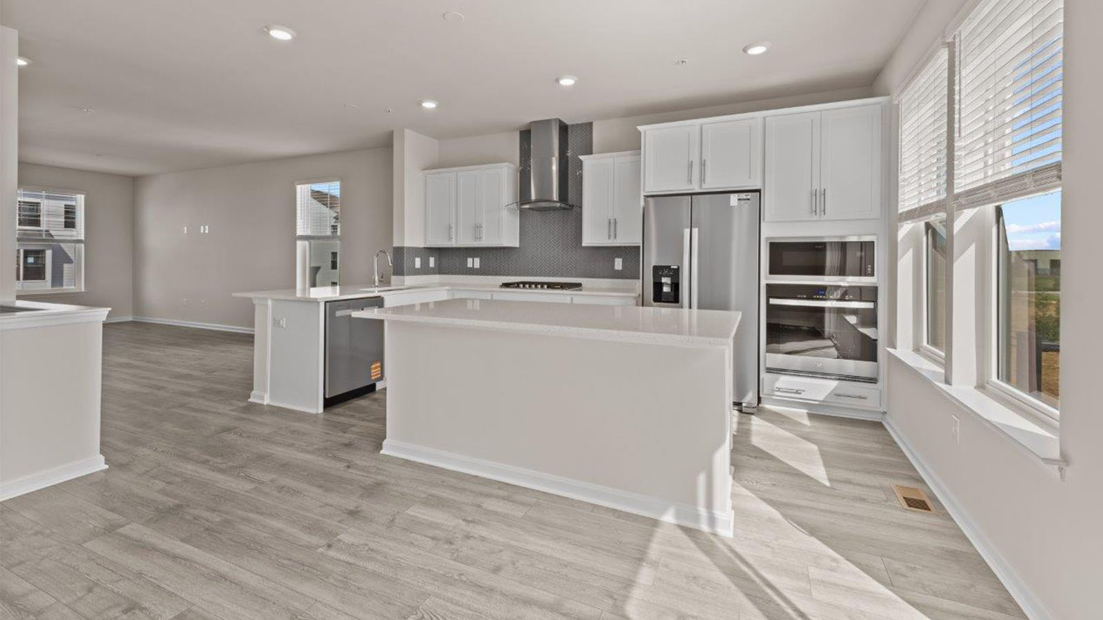 white shaker kitchen cabinets and quartz counters