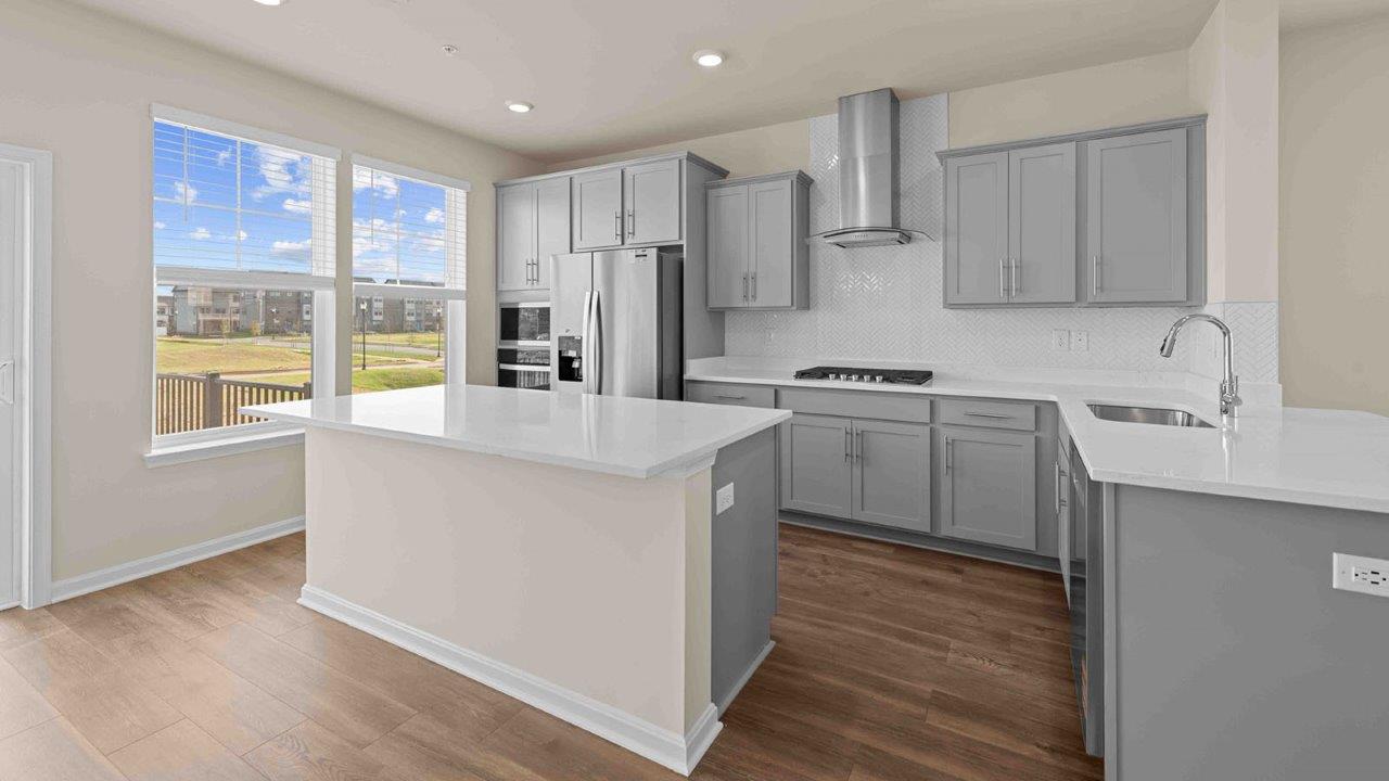 grey shaker kitchen cabinets and quartz counters