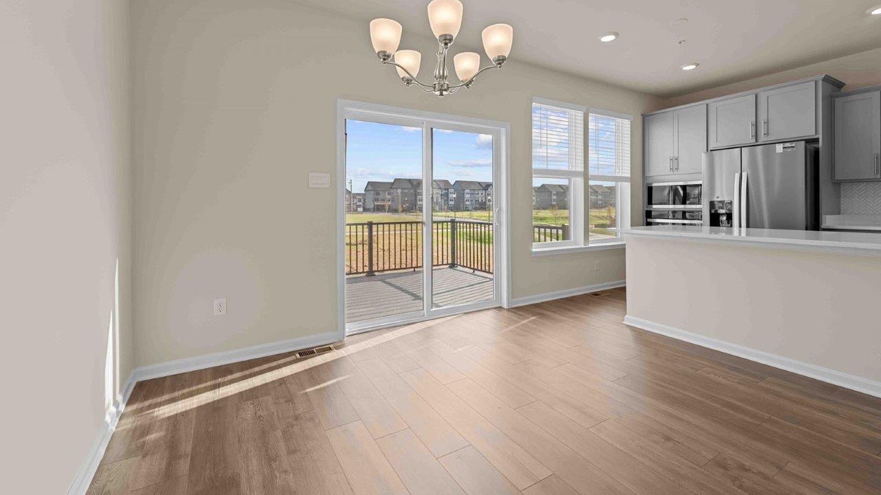 dining table leading to sliding back door
