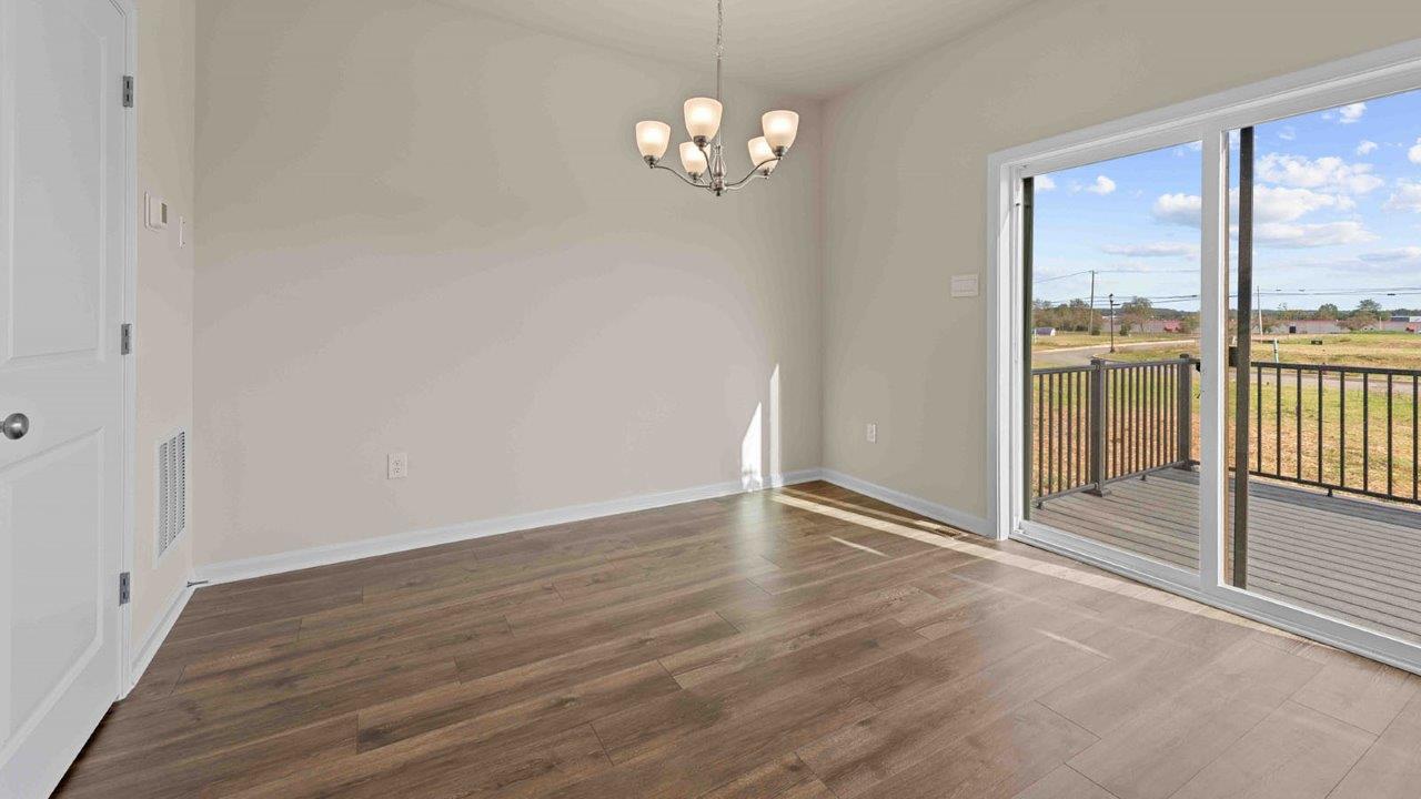 dining table leading to sliding back door