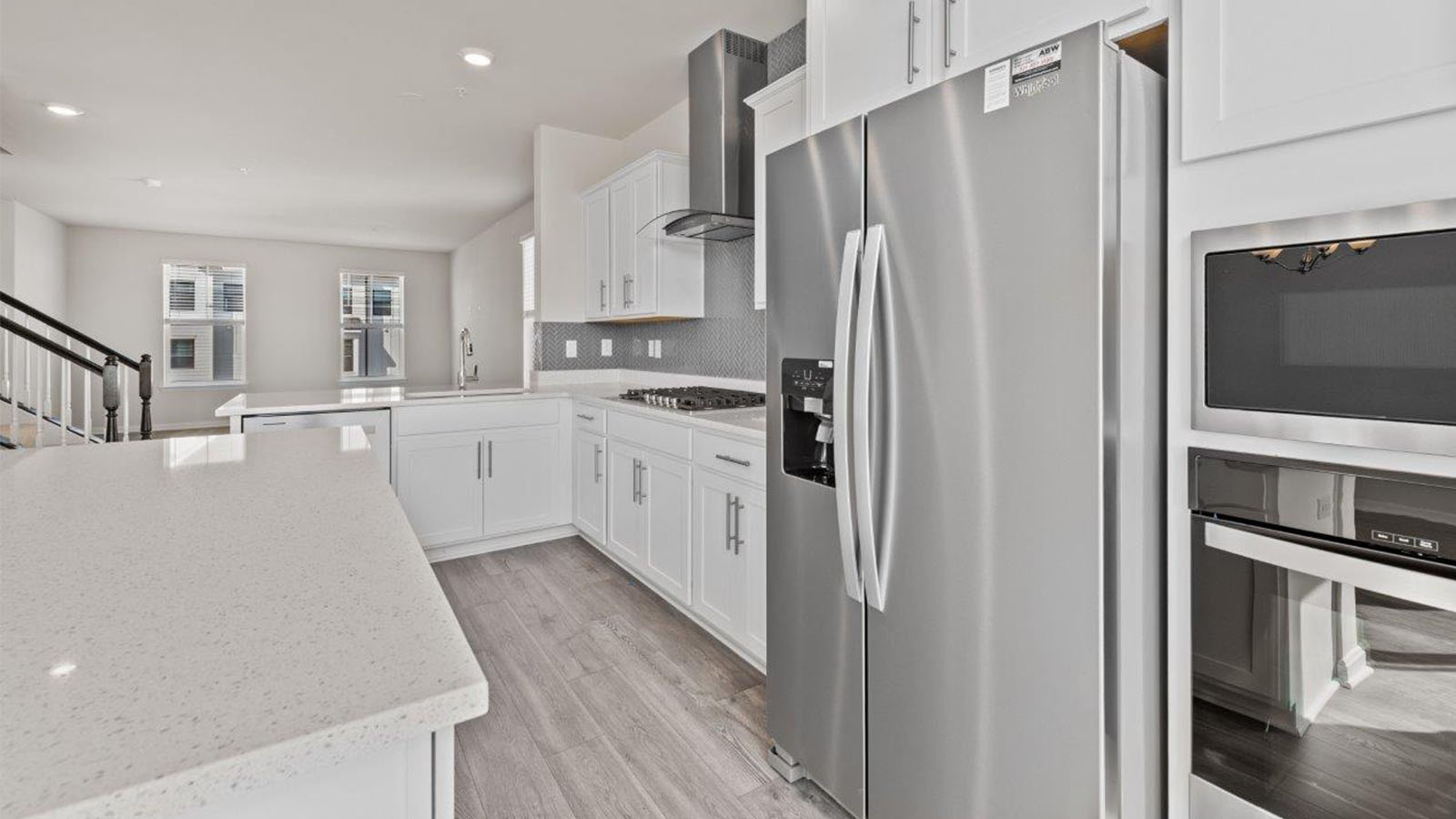 stainless steel appliances and glass hood fan