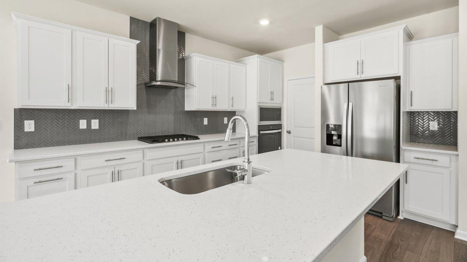white shaker cabinets and stainless steel appliances