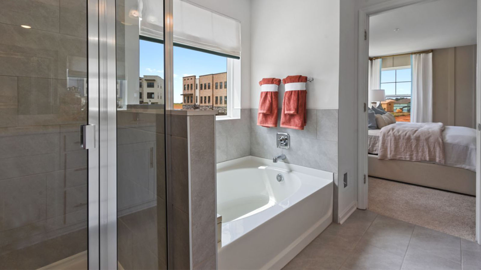 master bathroom with soaking tub and shower