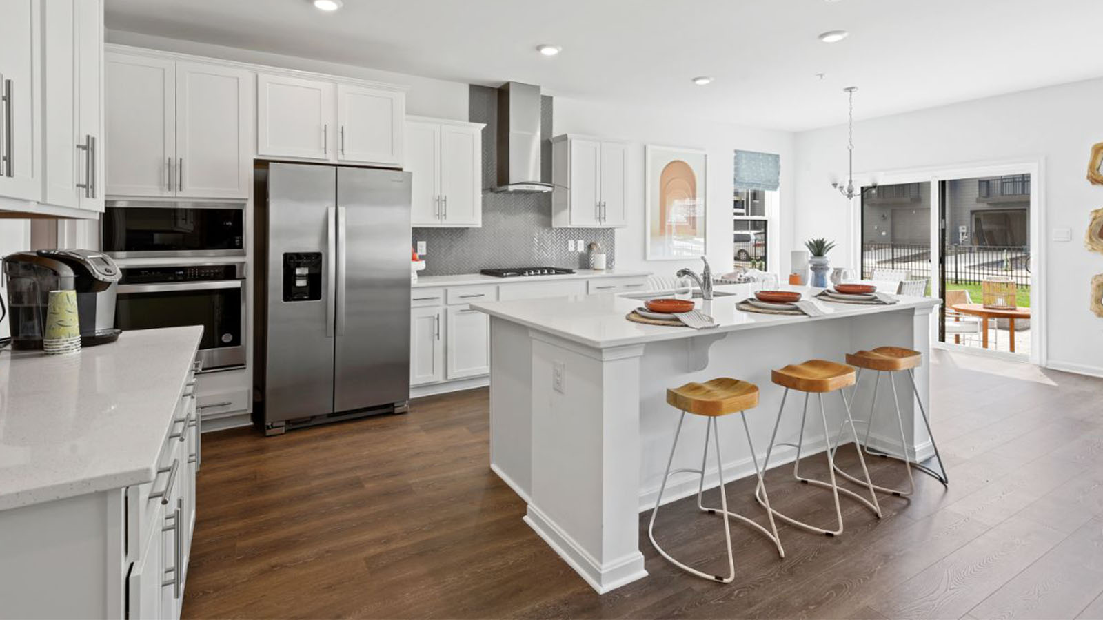 large kitchen with white shaker cabinets