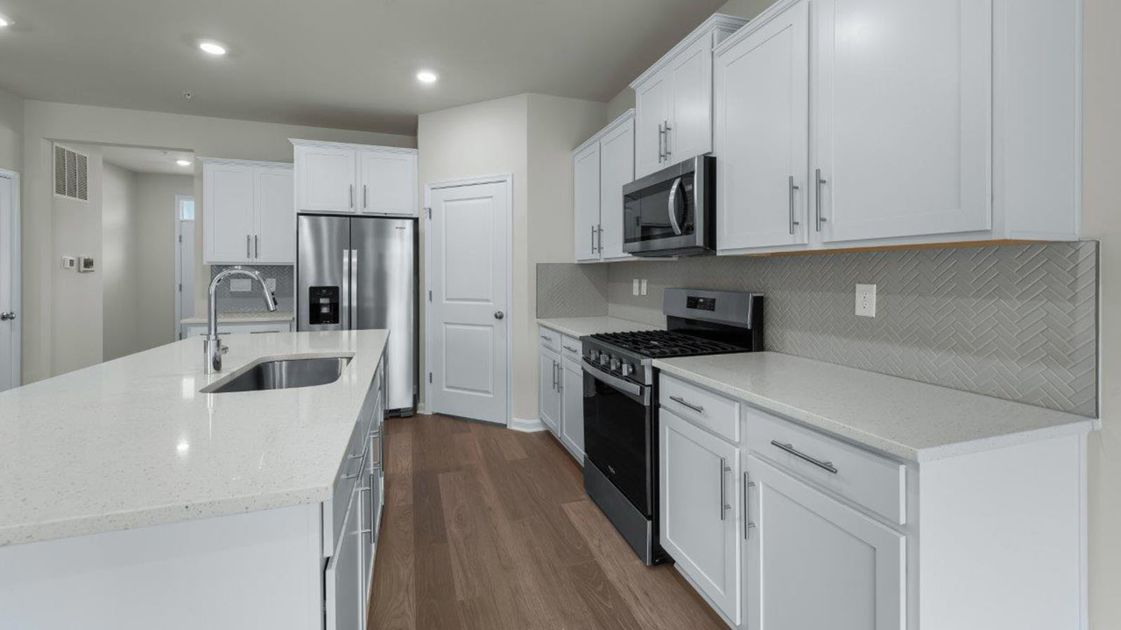 recessed lighting and luxury vinyl plank flooring