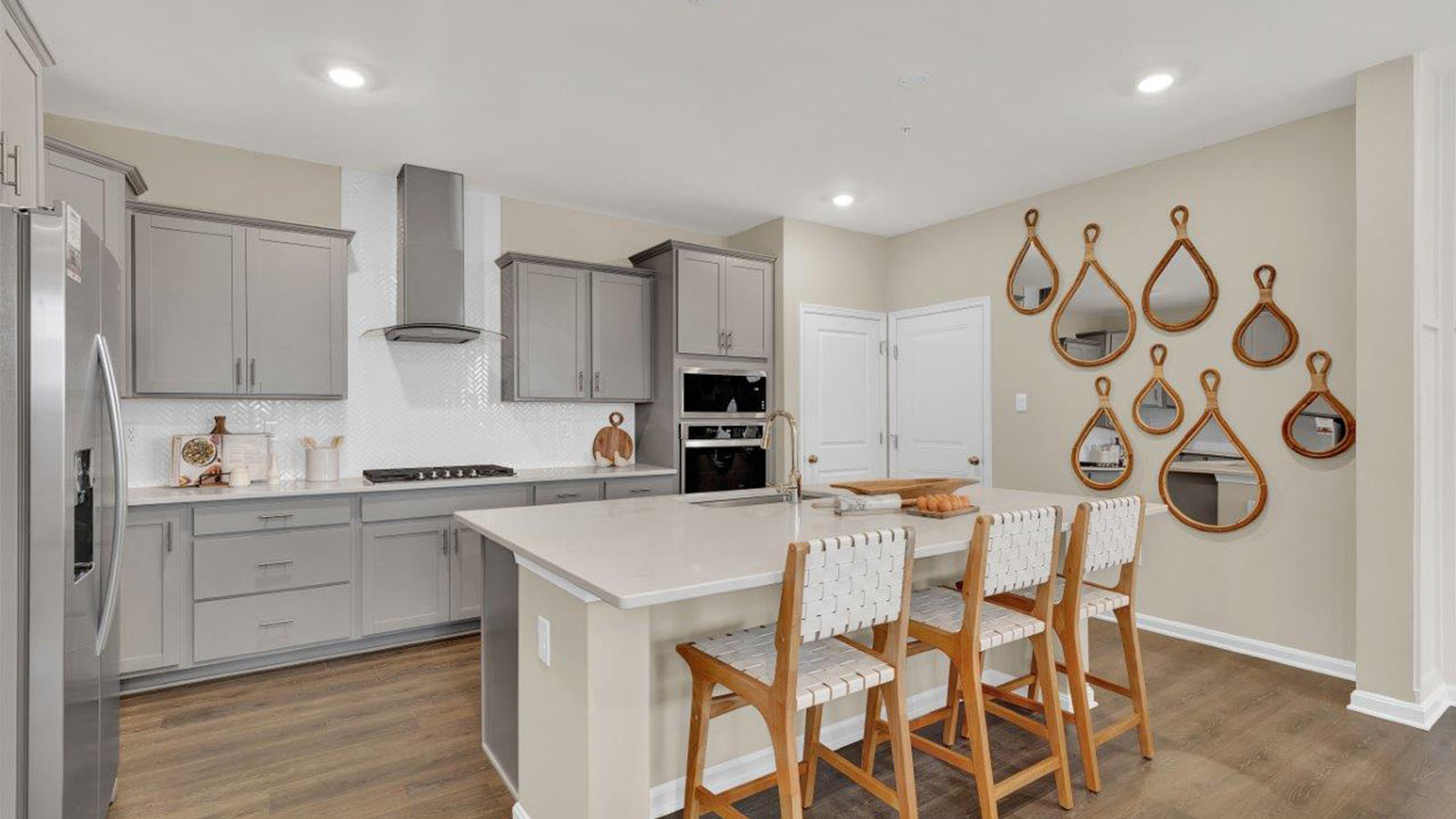 kitchen with shaker style cabinets and quartz counters