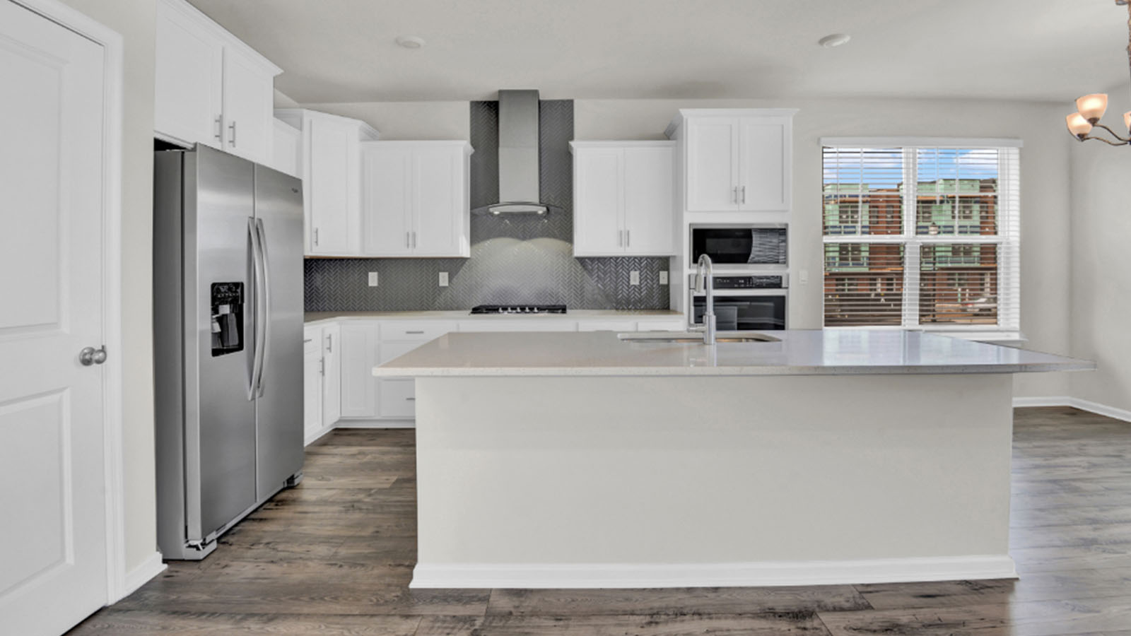 stainless steel appliances and glass hood fan