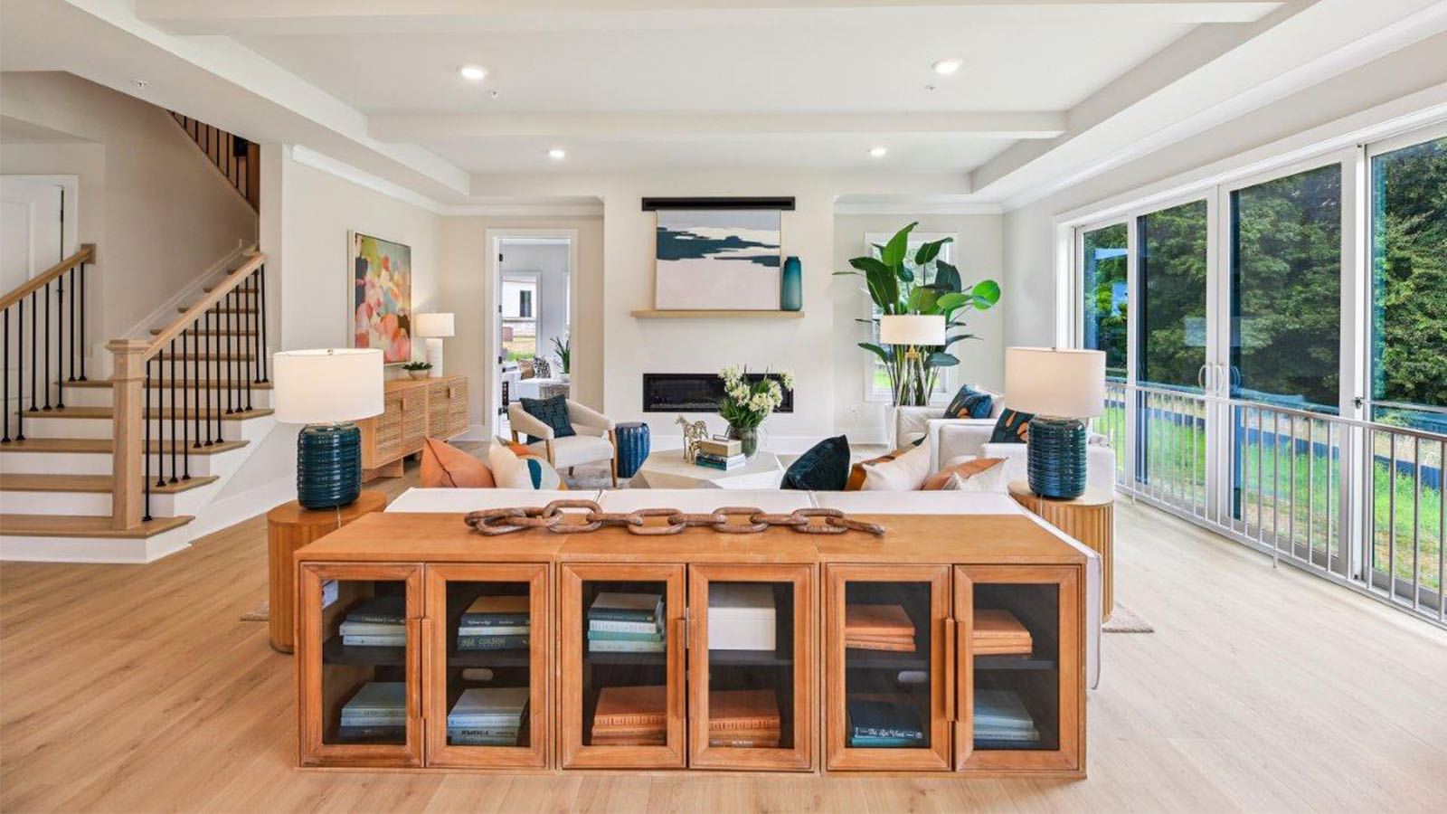 open concept living room facing linear fireplace