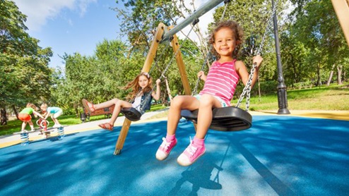 kid on swings
