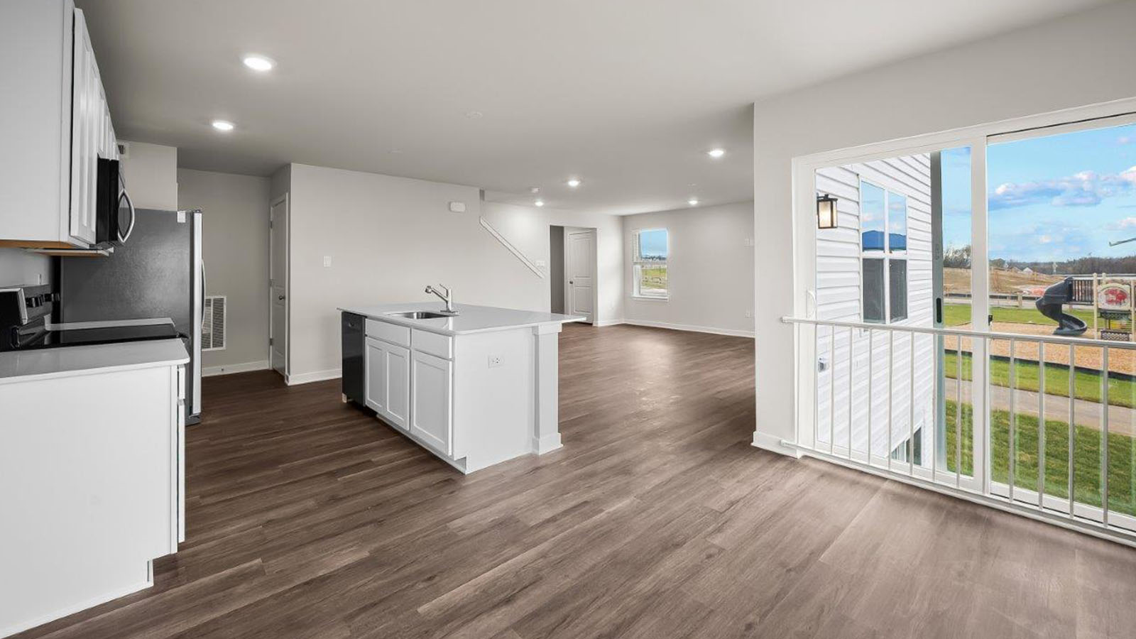 kitchen opening to living area