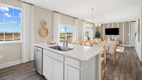 kitchen island with sink and dishwasher