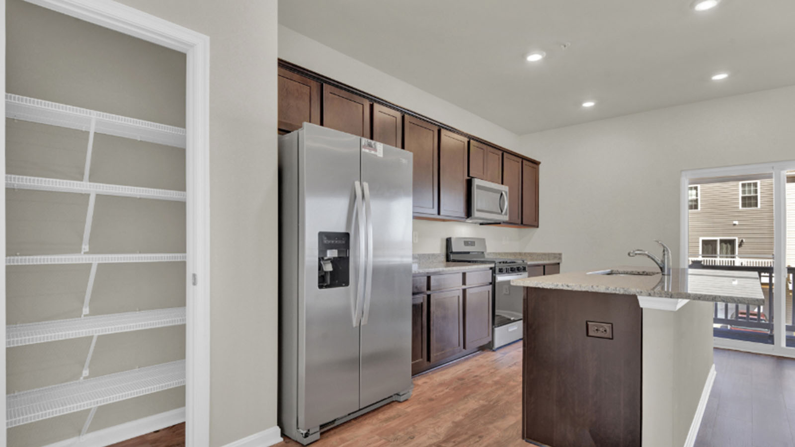 kitchen with shaker cabinets and central island