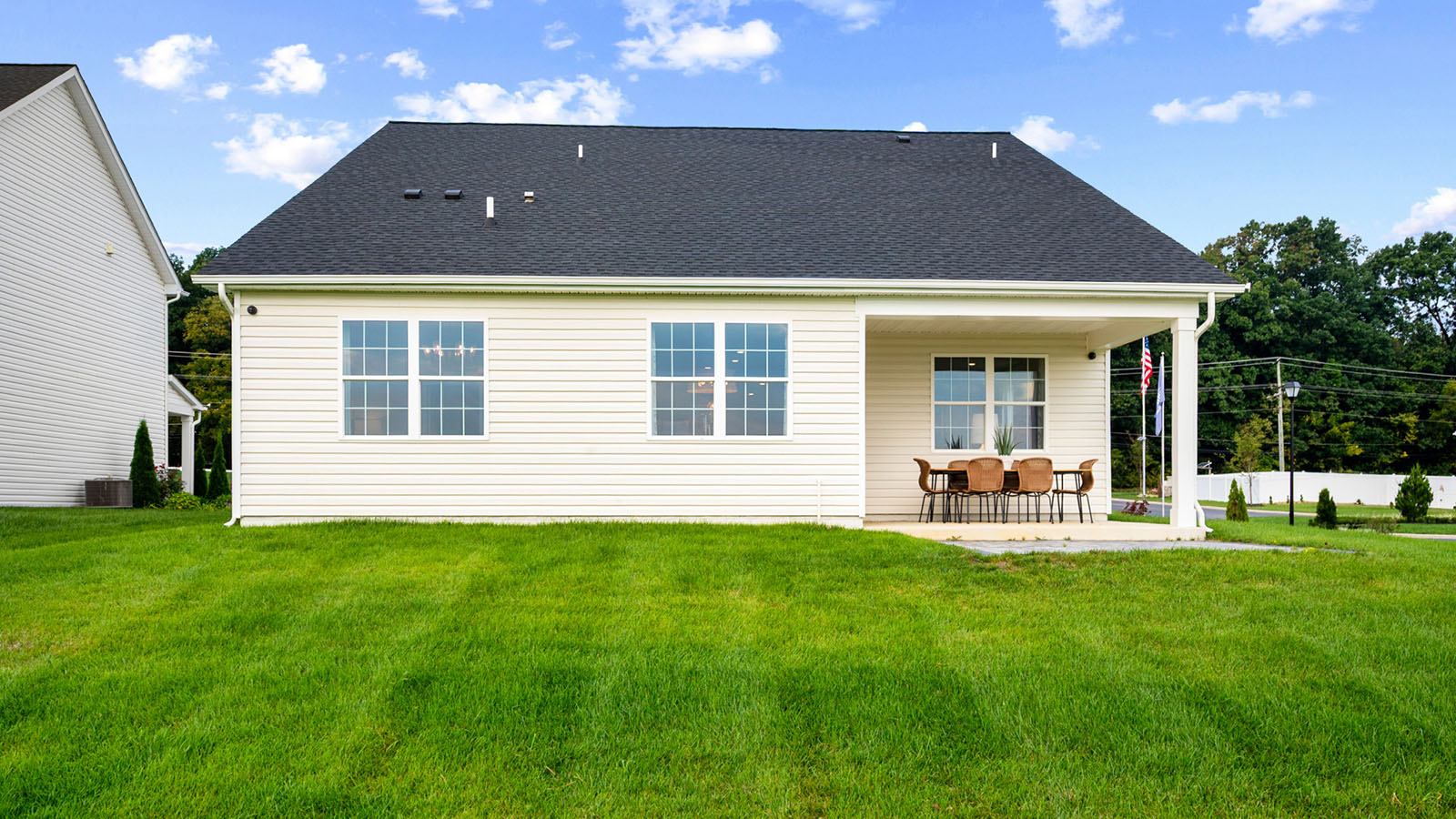 rear of ranch home with covered patio