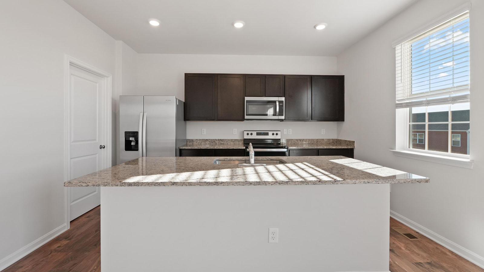 kitchen with dark shaker cabinets