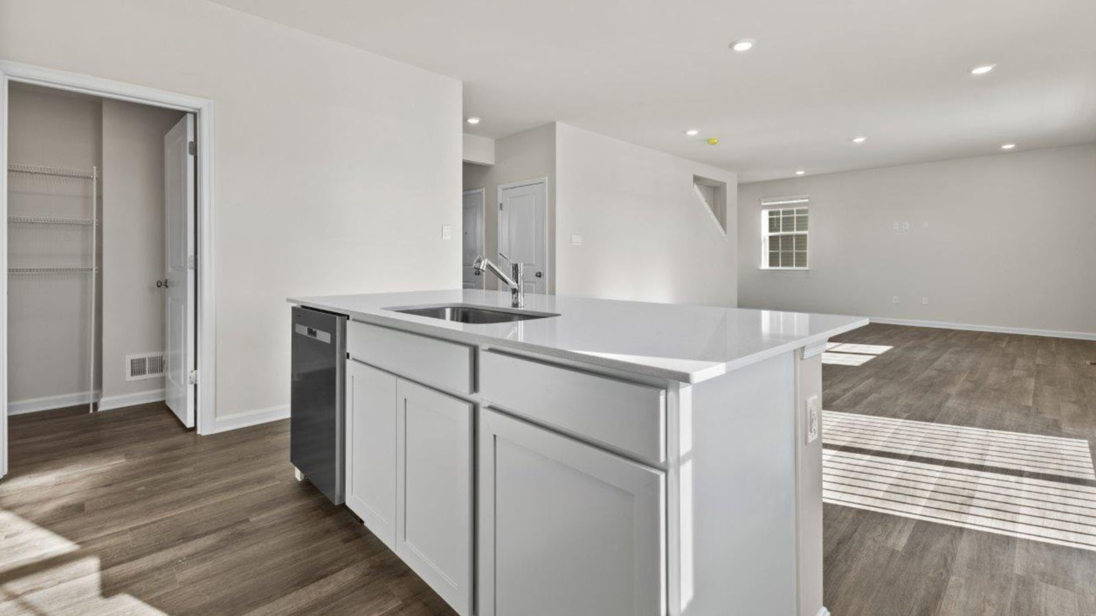 central island with dishwasher and sink