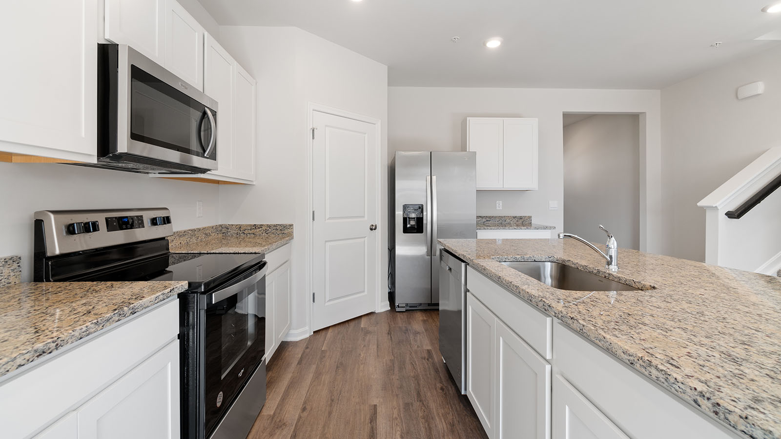 white shaker cabinets with stainless steel appliances