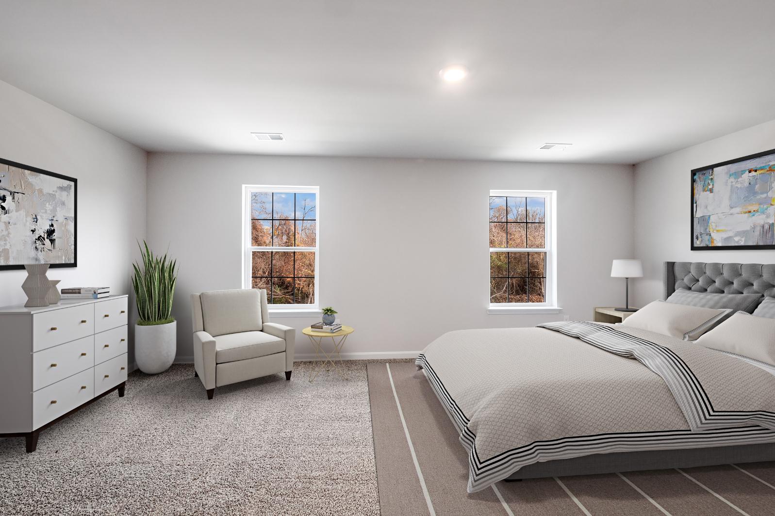 Galen plan bedroom with bed, chair, nightstand, dresser, and window