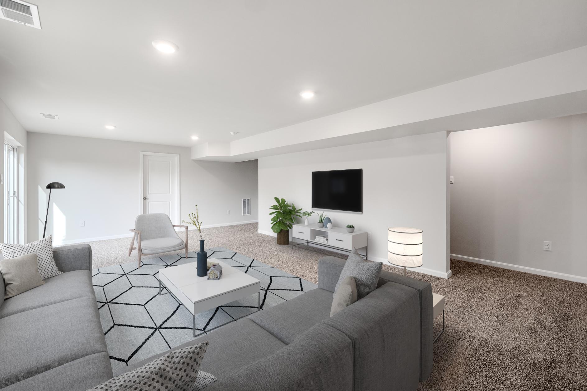 Galen plan alternate view of living room with couch, loveseat, coffee table, and chair