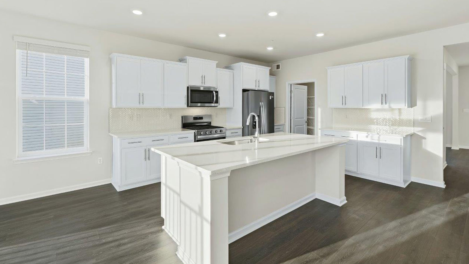 white kitchen with large central island