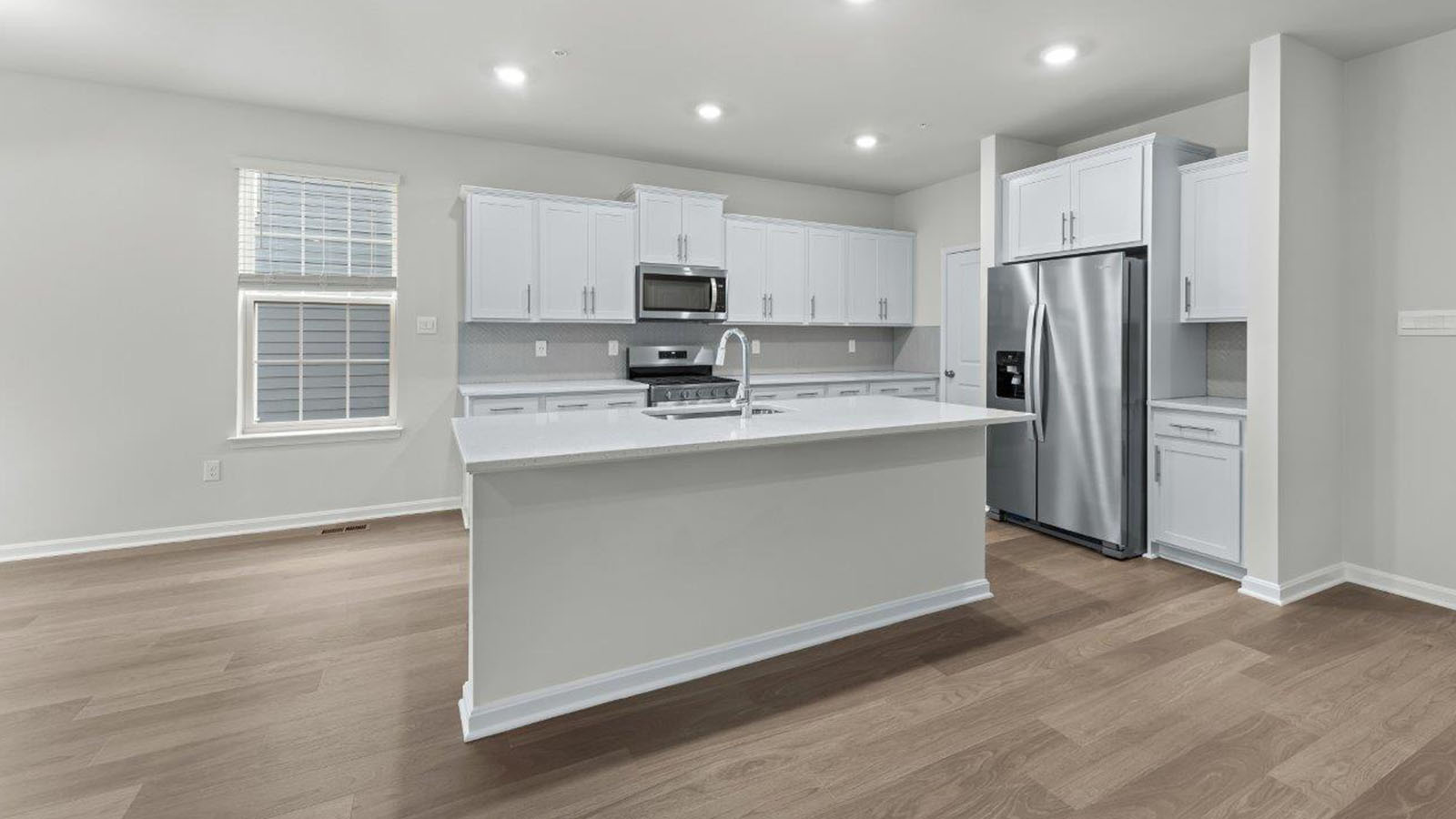 kitchen with central island and corner pantry
