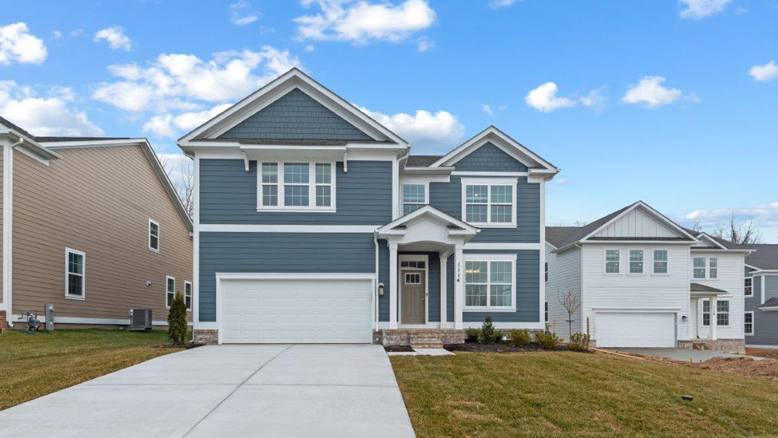 blue exterior with two car garage