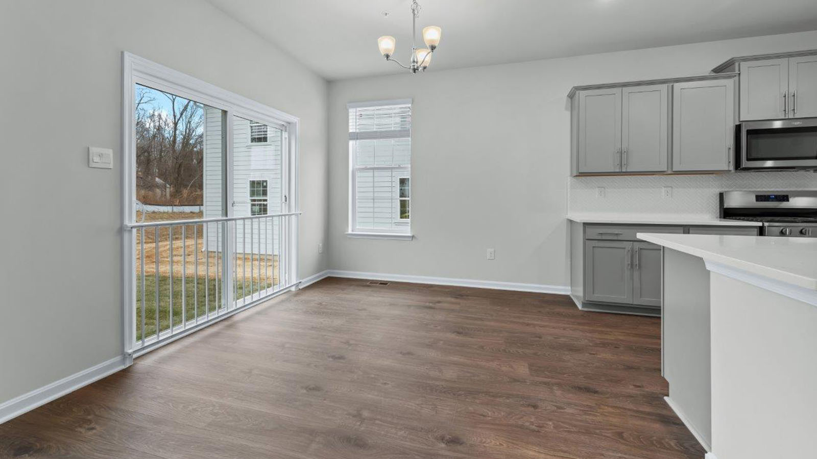 dining area leading to sliding back door
