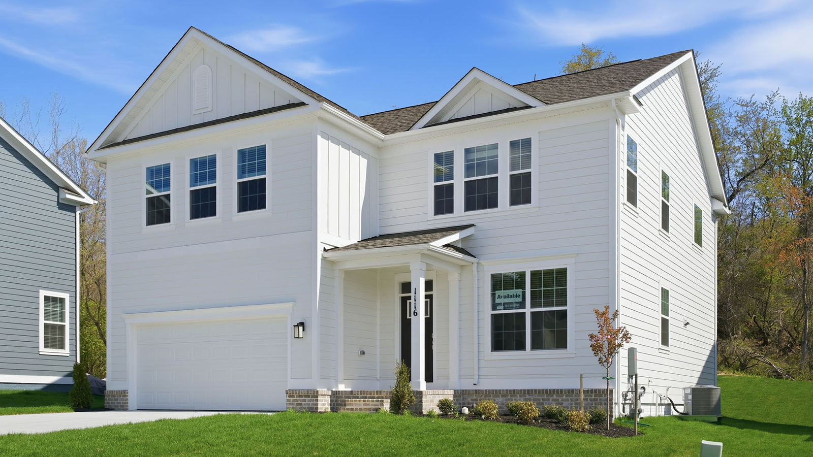 white hardie plank siding with dark front door