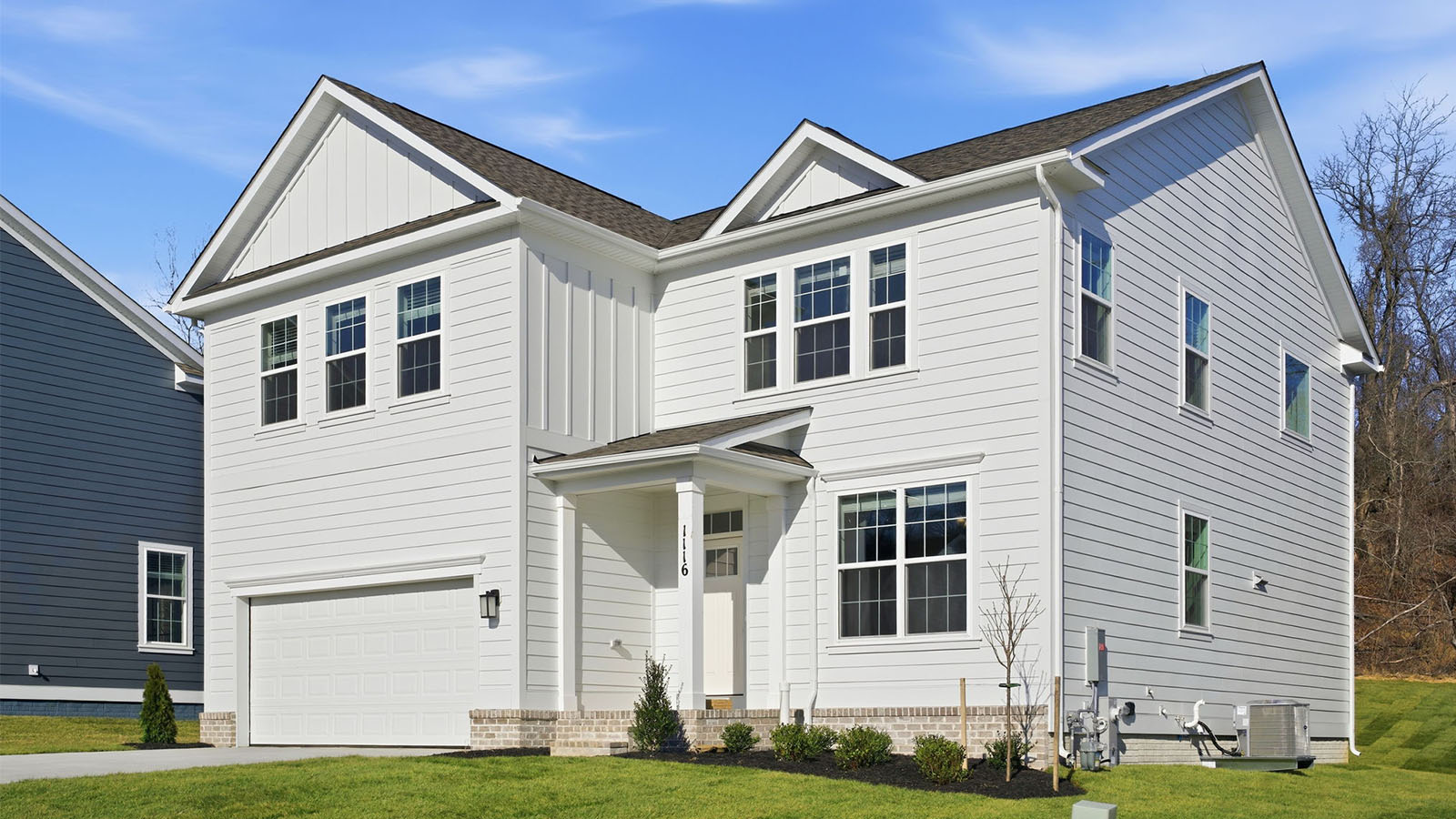 front elevation with white siding
