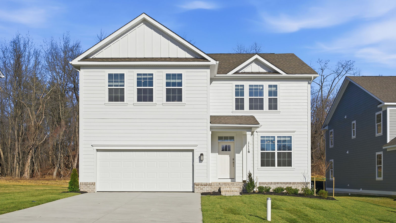 front elevation with white siding