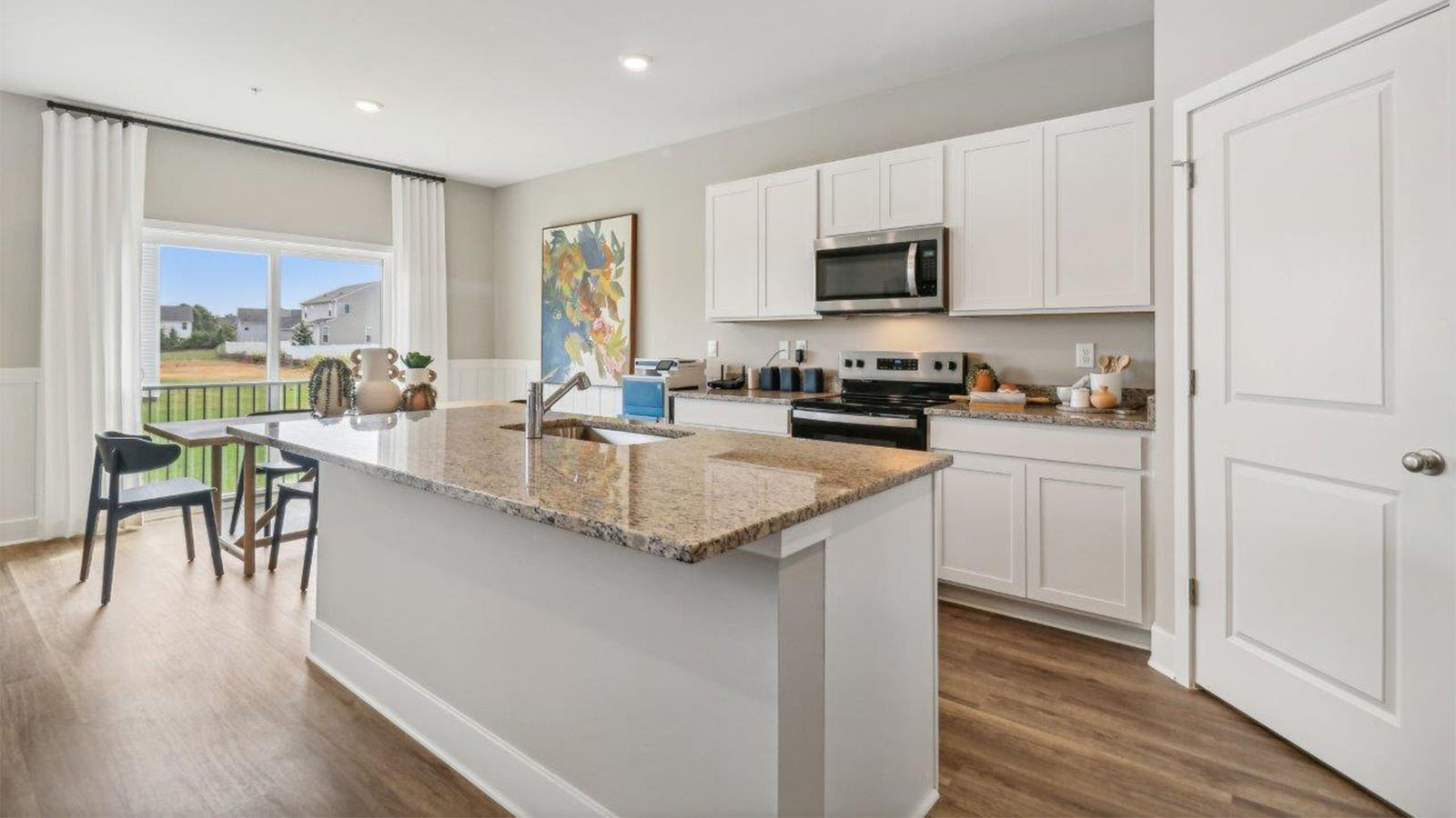 kitchen with shaker style cabinets and granite counters