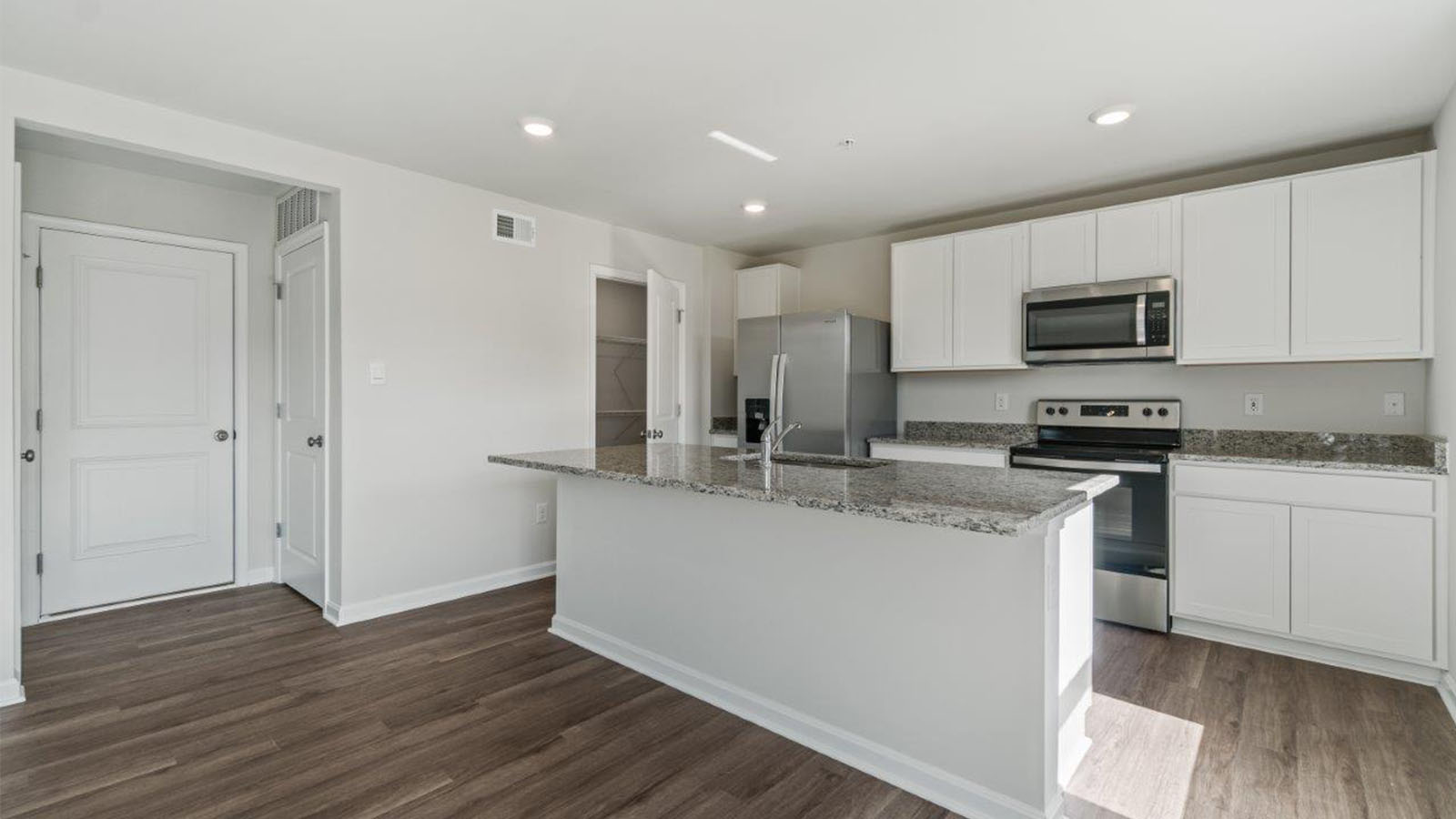 kitchen with shaker style cabinets and granite counters