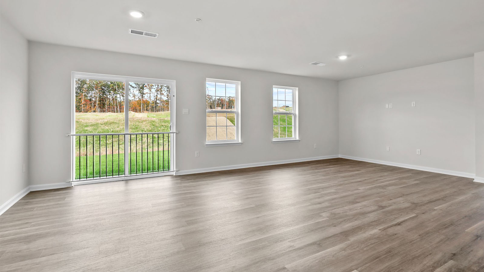 open concept living room with sliding back door