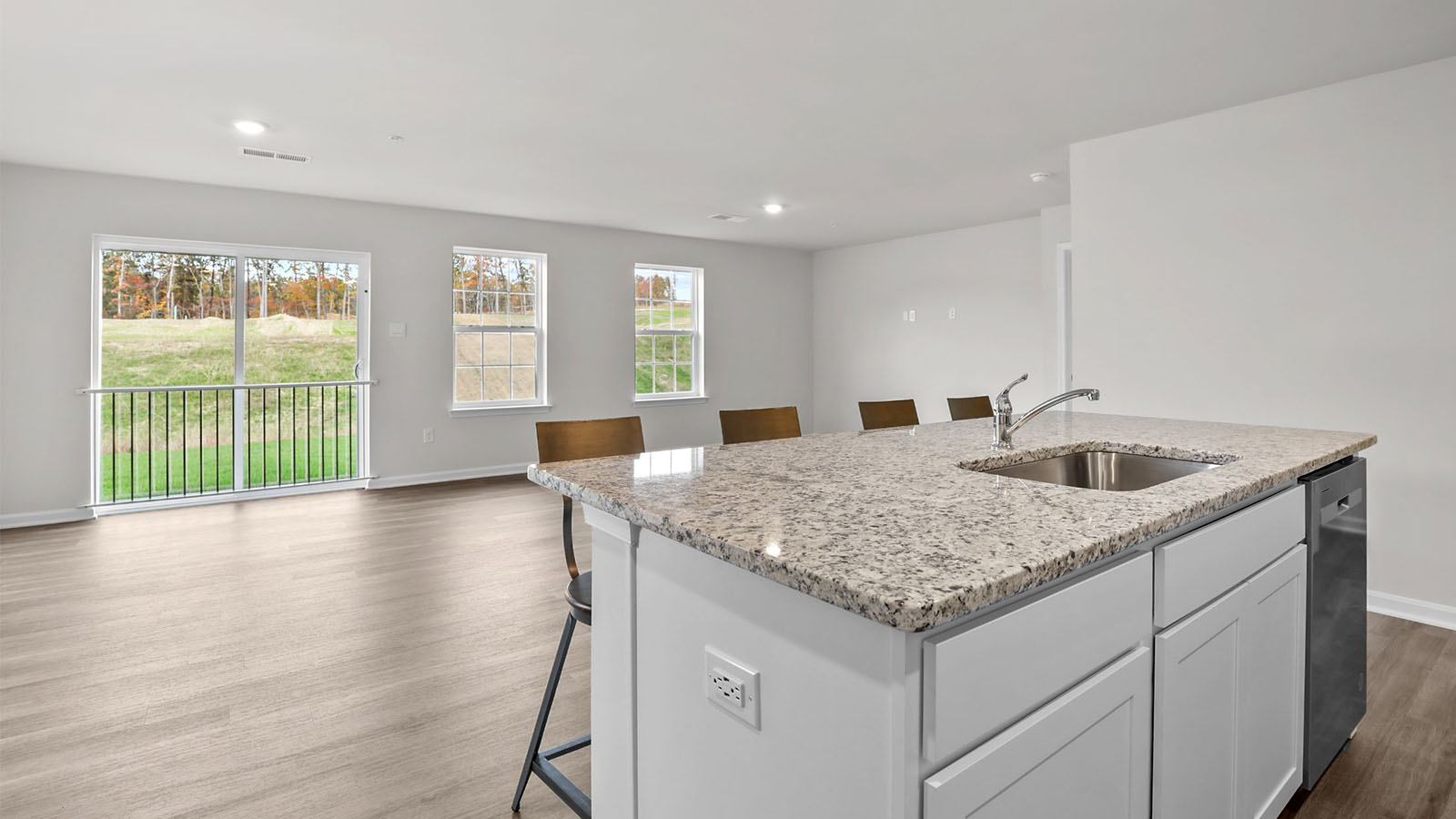 island with sink facing into living room