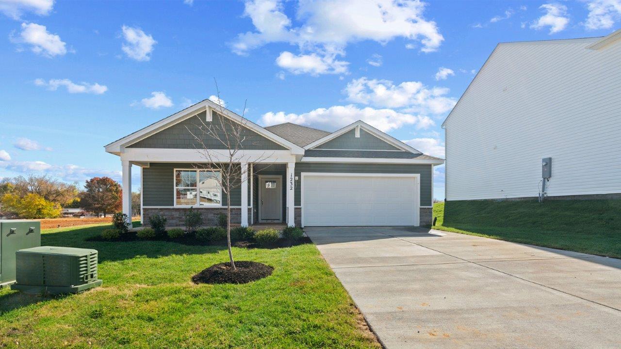 ranch home with porch and two car garage