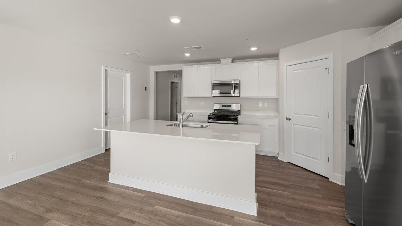 recessed lighting and luxury vinyl plank floors