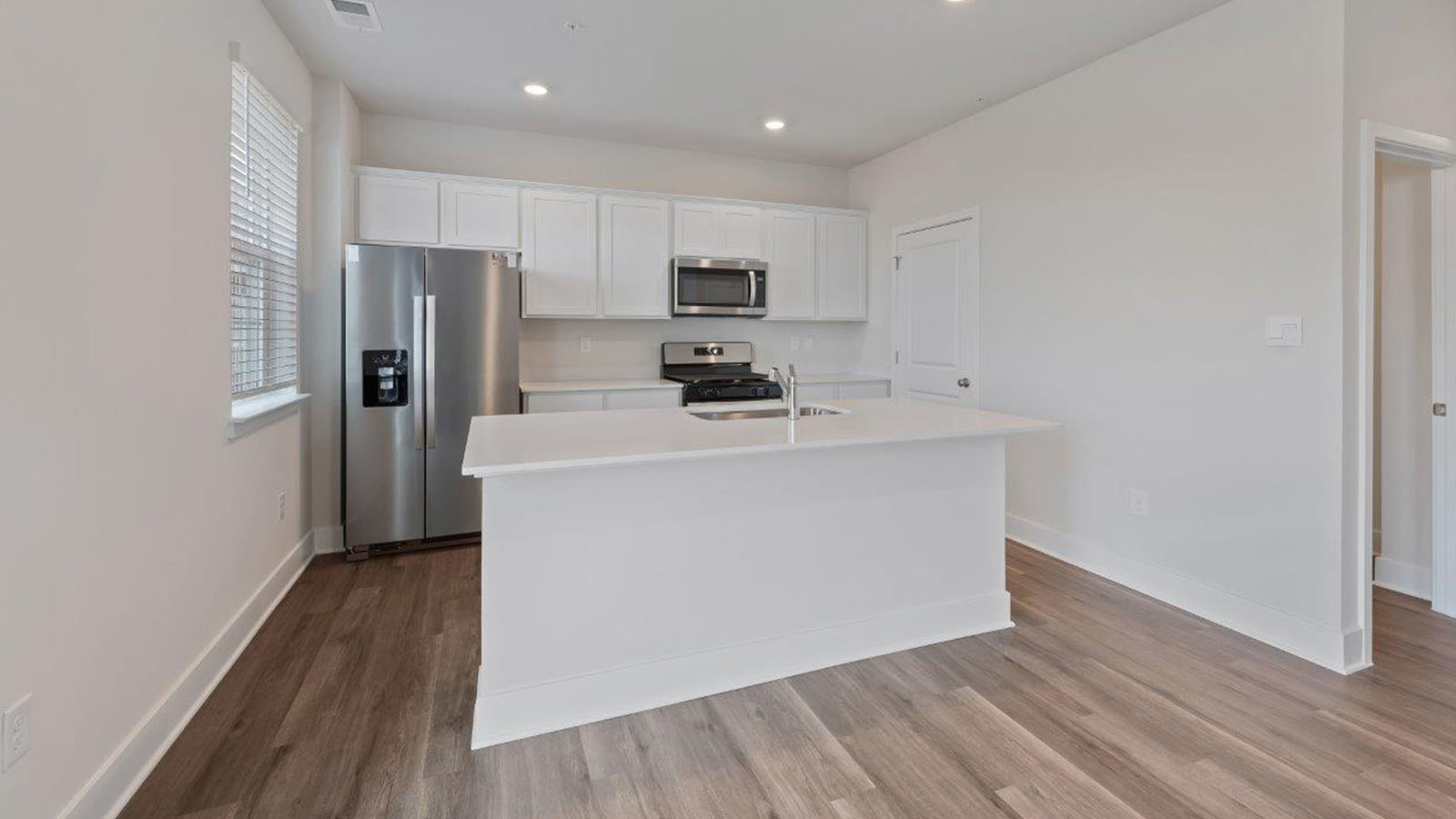 kitchen with white shaker cabinets and granite counters