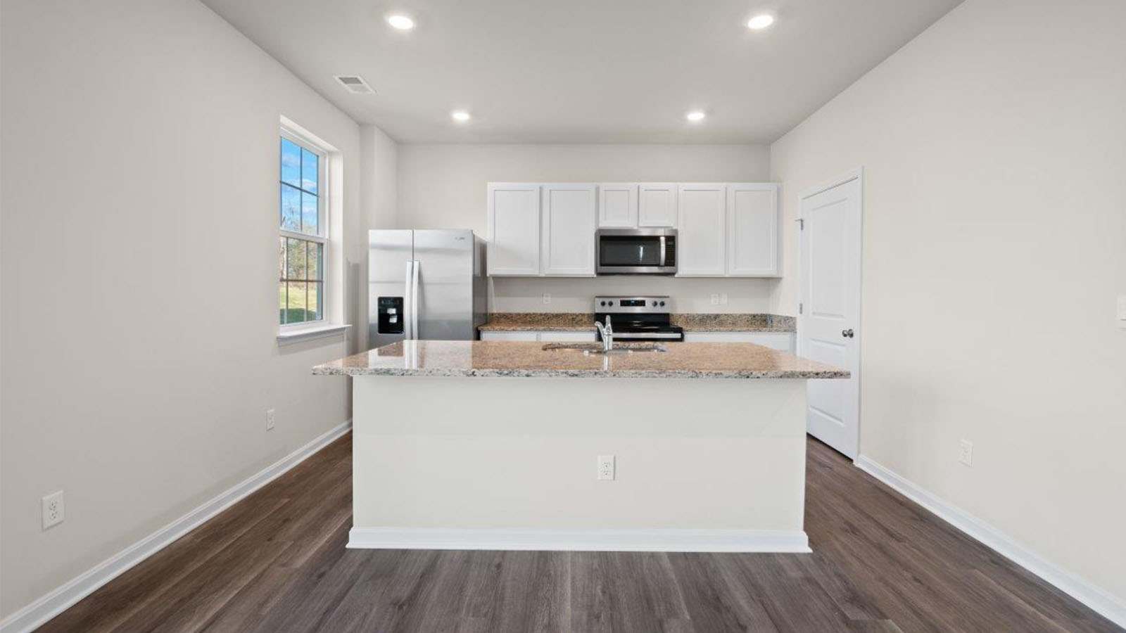 white kitchen with central island