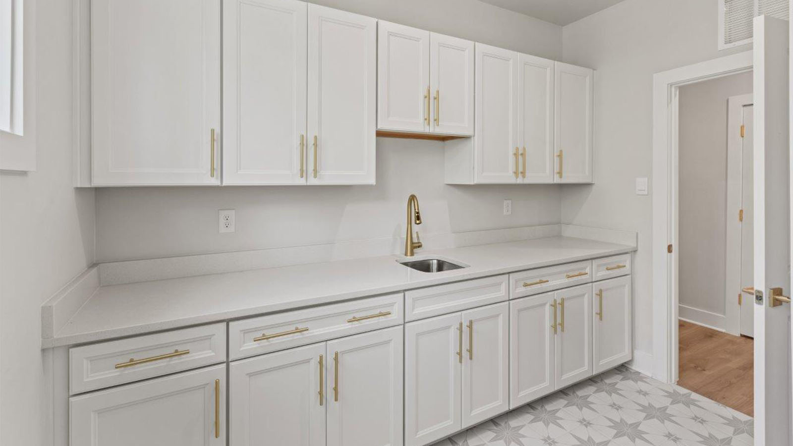 laundry room with cabinets and folding counters