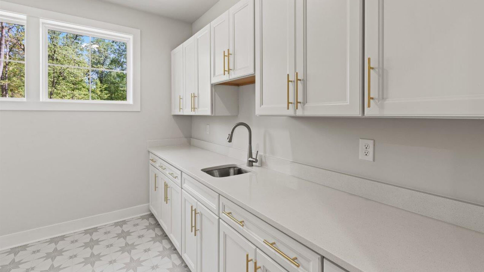 laundry room with cabinets and folding counters