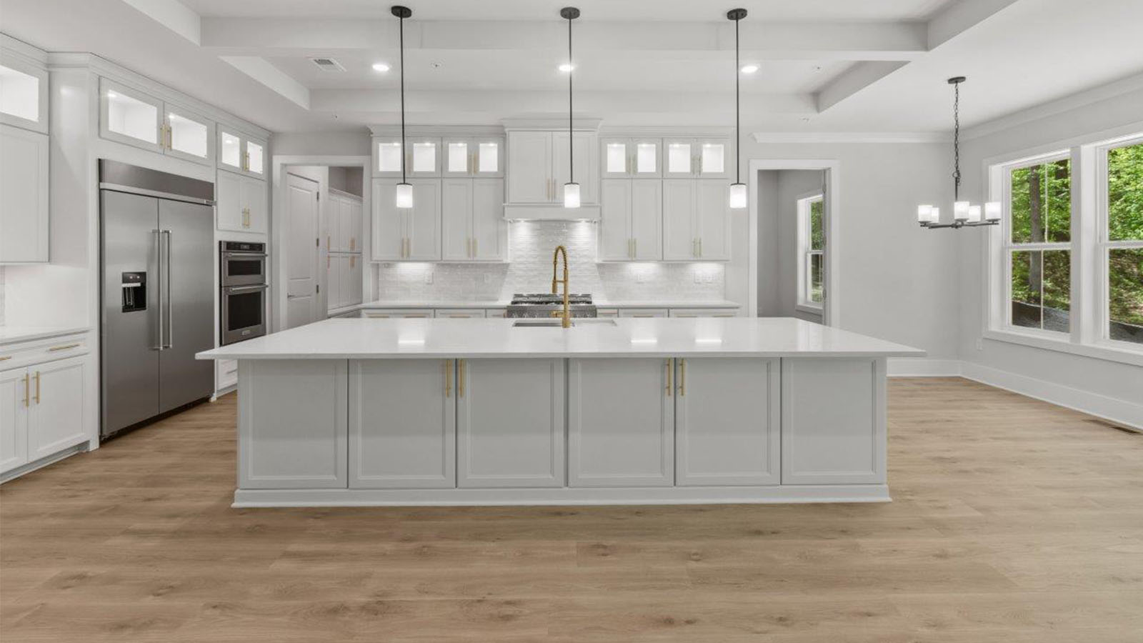 spacious island with seating and pendant lights