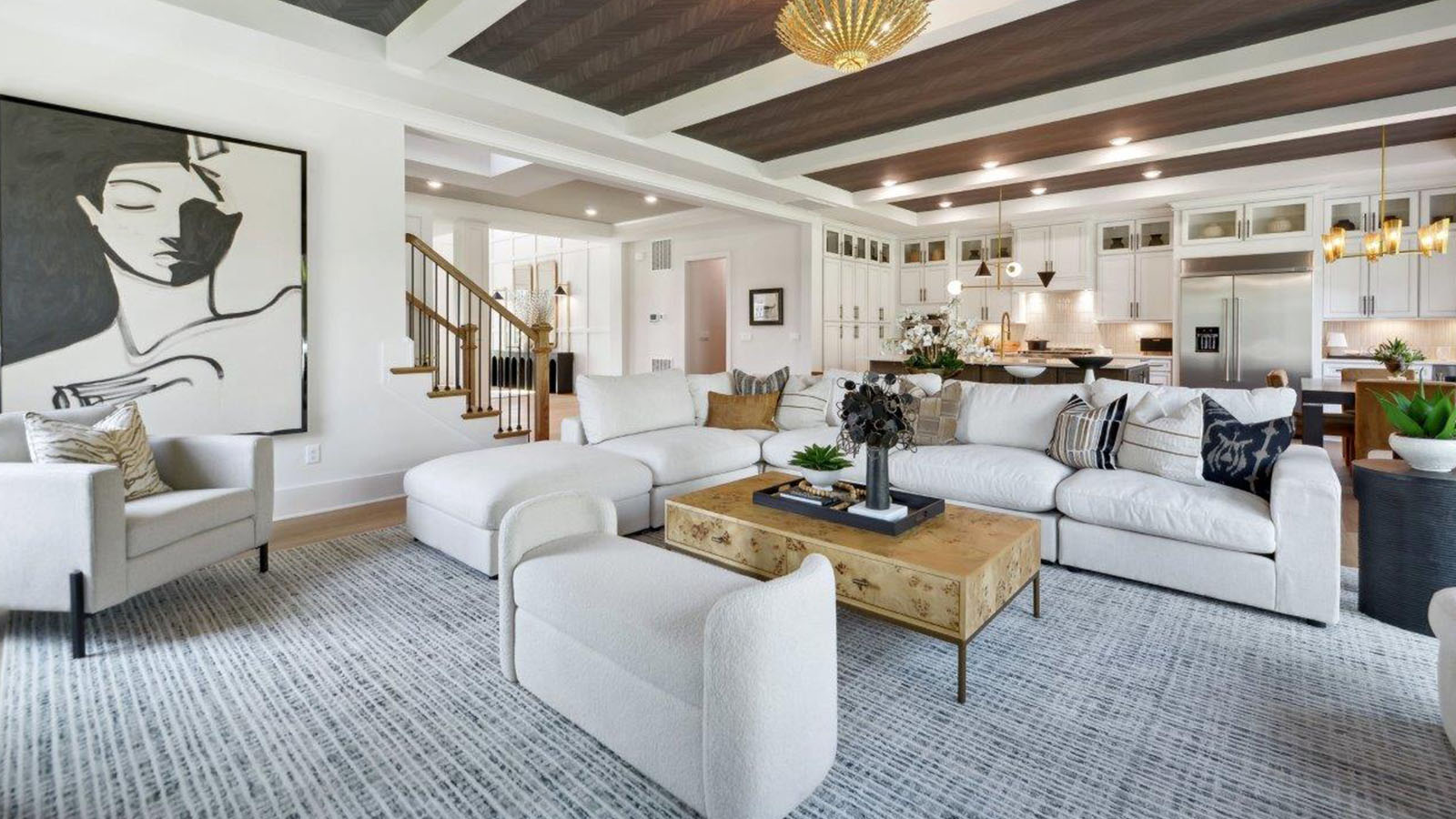 open concept living room with tray ceiling
