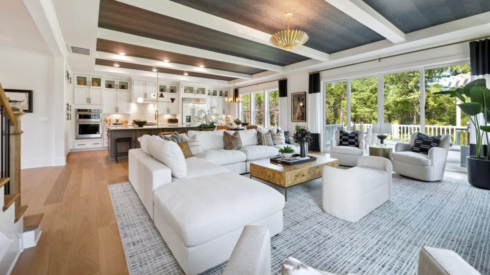 open concept living room with tray ceiling